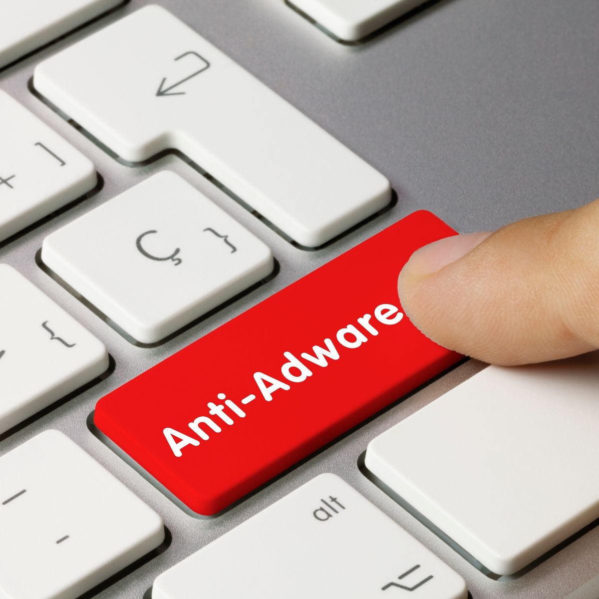 Red keyboard button that says &quot;Anti-Adware&quot; being pressed by finger