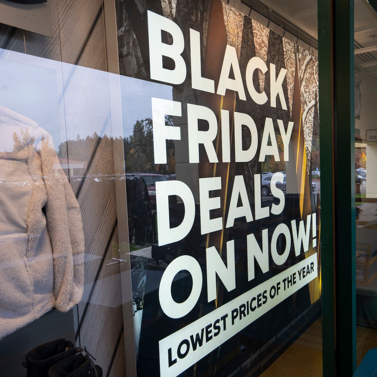 Black Friday Deals advertisement is shown on the storefront of a Columbia Sportswear Factory. Online shopping for Black Friday deals can have more potential risks. 