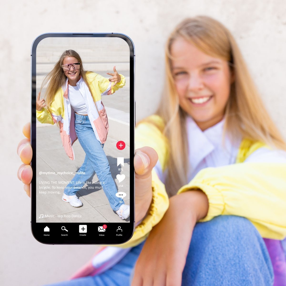 Blond young girl showing phone with her on tiktok video 
