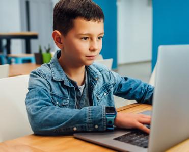 Boy working on a laptop