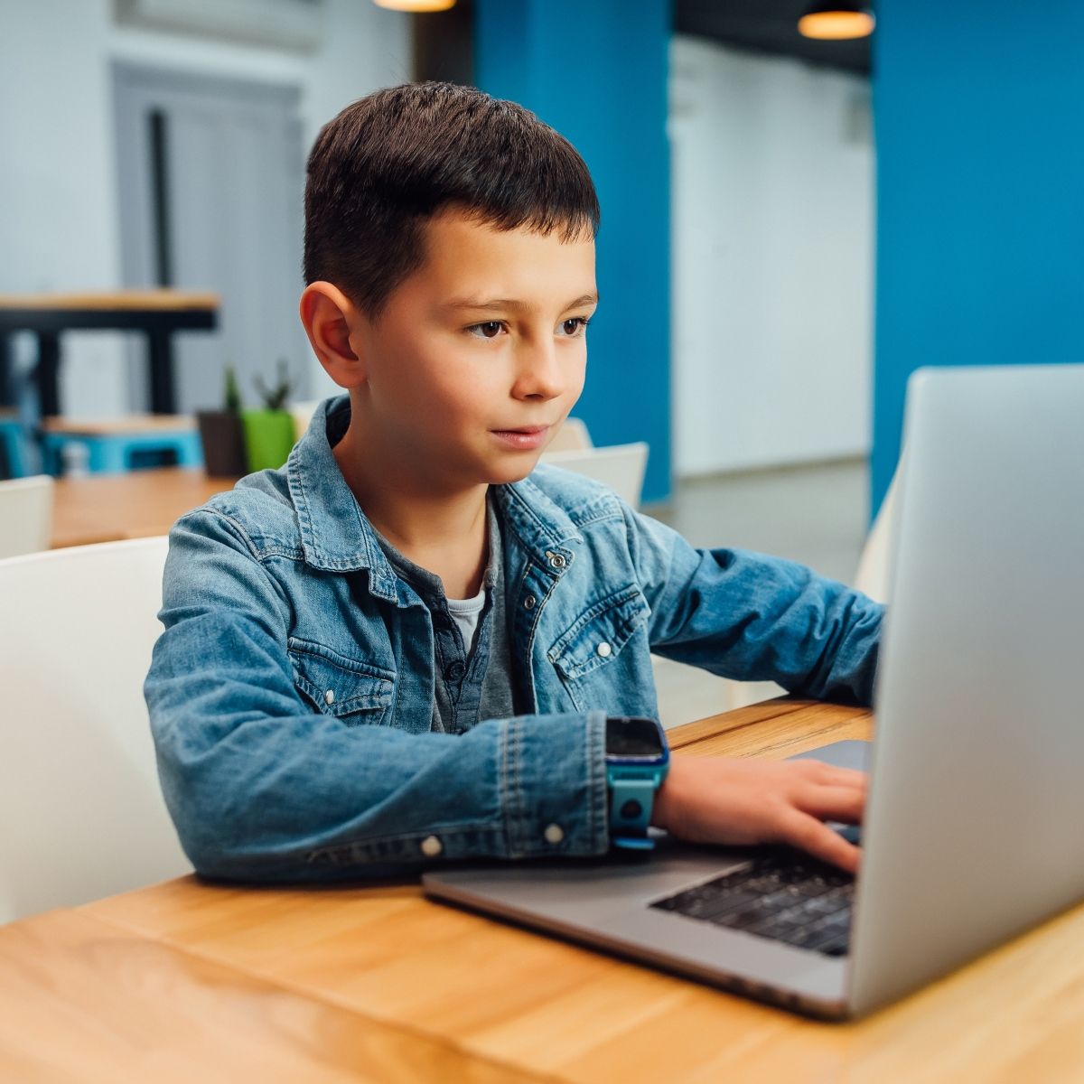 Boy working on a laptop