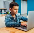 Boy working on a laptop