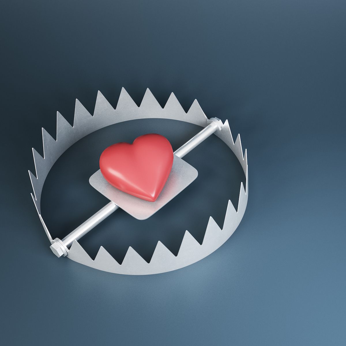 A red heart sits in the middle of a steel bear trap to signify catfishing and other romance scams