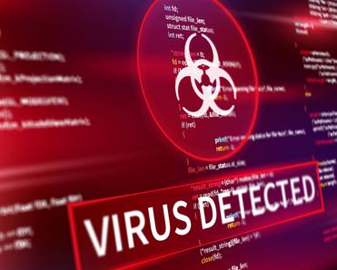 A closeup of a computer screen with the words &quot;virus detected&quot; 
