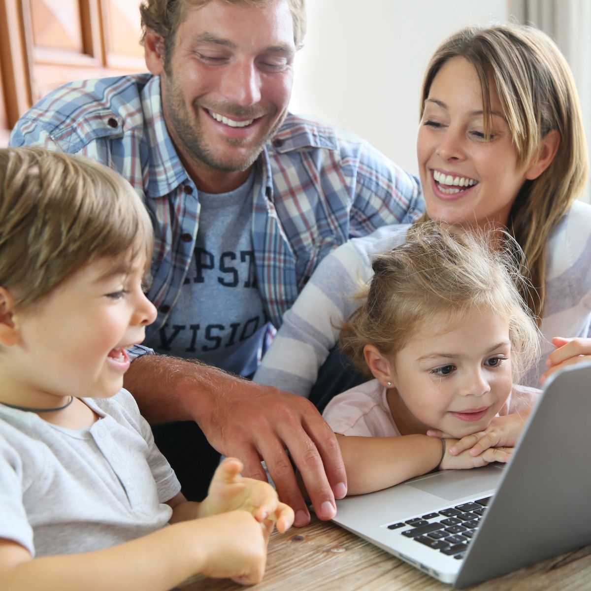 Family looking at a laptop