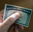 Hand holding a Social Security card