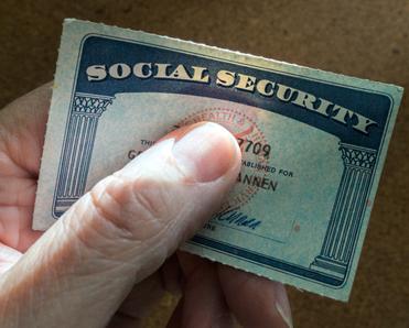Hand holding a Social Security card