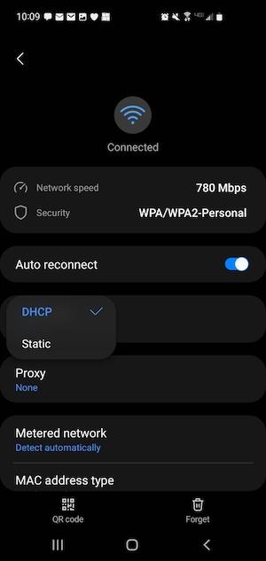 A screenshot of an Android phone with the Wi-Fi network settings menu open and DHCP selected.