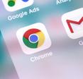 A close-up of the Google Chrome web browser app icon on a cell phone screen.