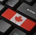 A computer keyboard with a button that has the Canadian flag.
