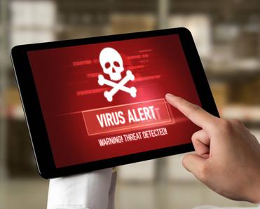 A tablet user is pointing at the virus alert on their tablet.