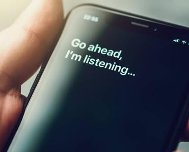 A smartphone screen with text from a voice-activated digital assistant.