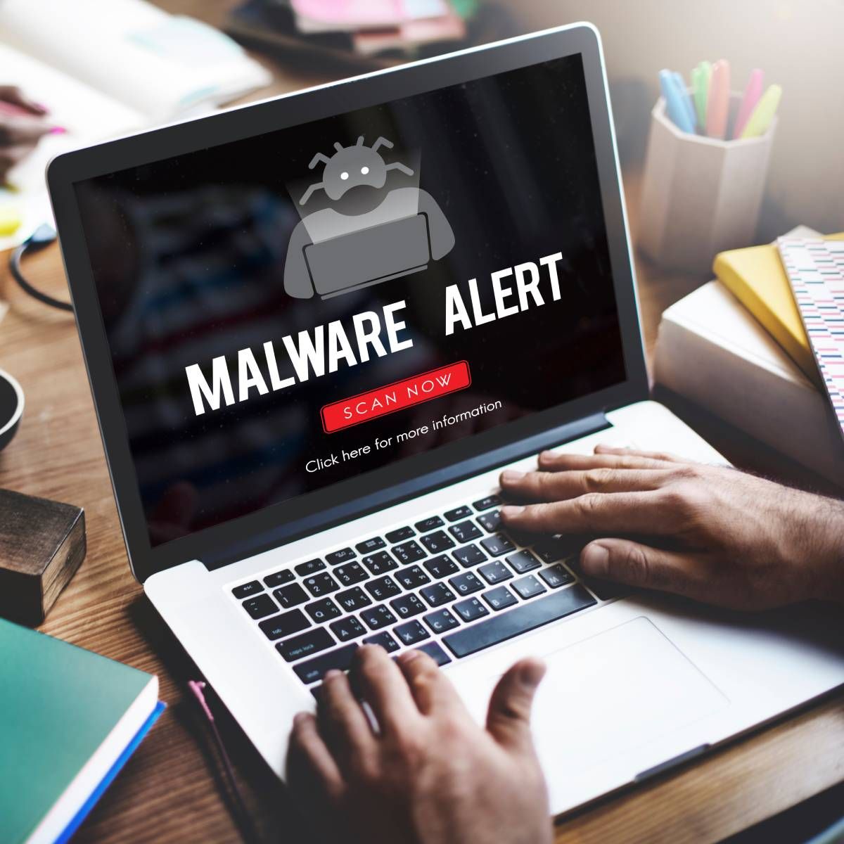 A laptop receiving a malware alert.