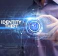 Abstract image of blue concentric circles around someone holding a lock symbol with the words &quot;Identity Theft&quot;