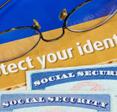 Some text that reads &quot;protect your identity&quot; with two Social Security cards underneath.