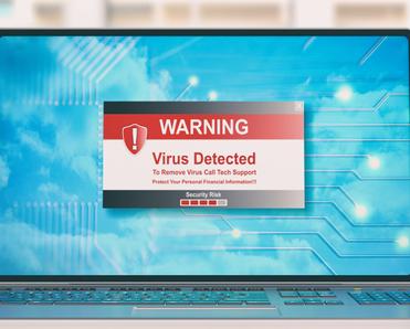 A laptop screen showing a red and white warning that a virus was detected