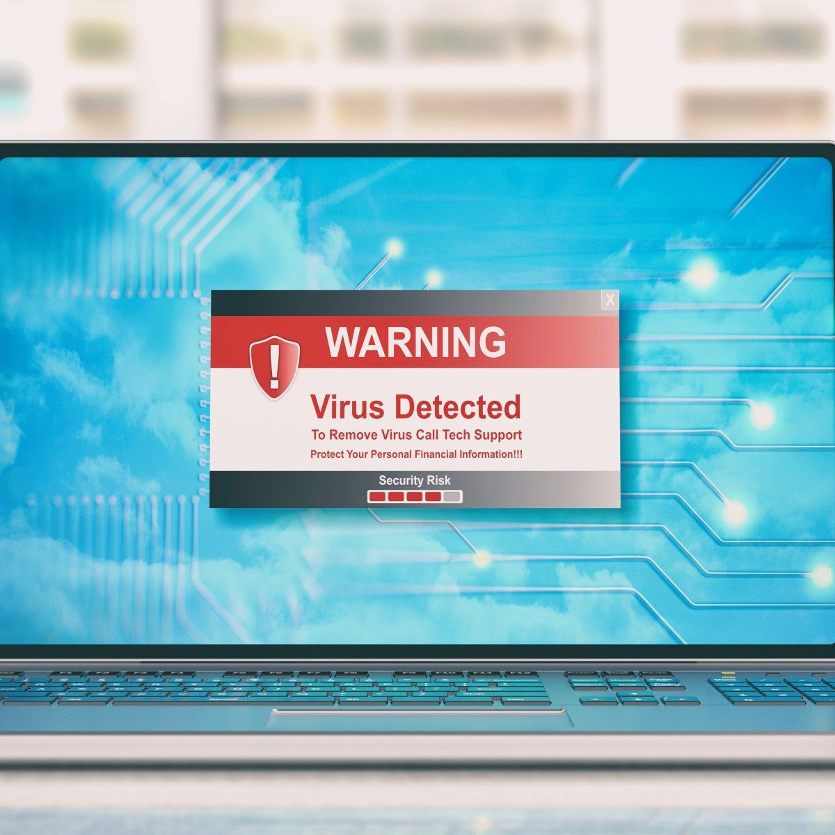 A laptop screen showing a red and white warning that a virus was detected