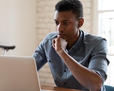 Man looking at a laptop computer