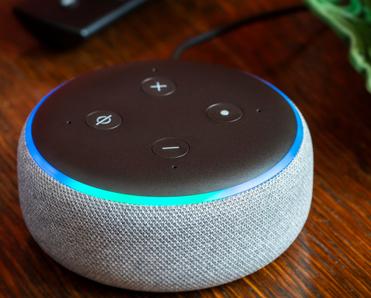 A close-up photo of a 3rd generation Amazon Echo Dot — if you own one of these, you should opt out of Amazon Sidewalk Wi-Fi sharing.