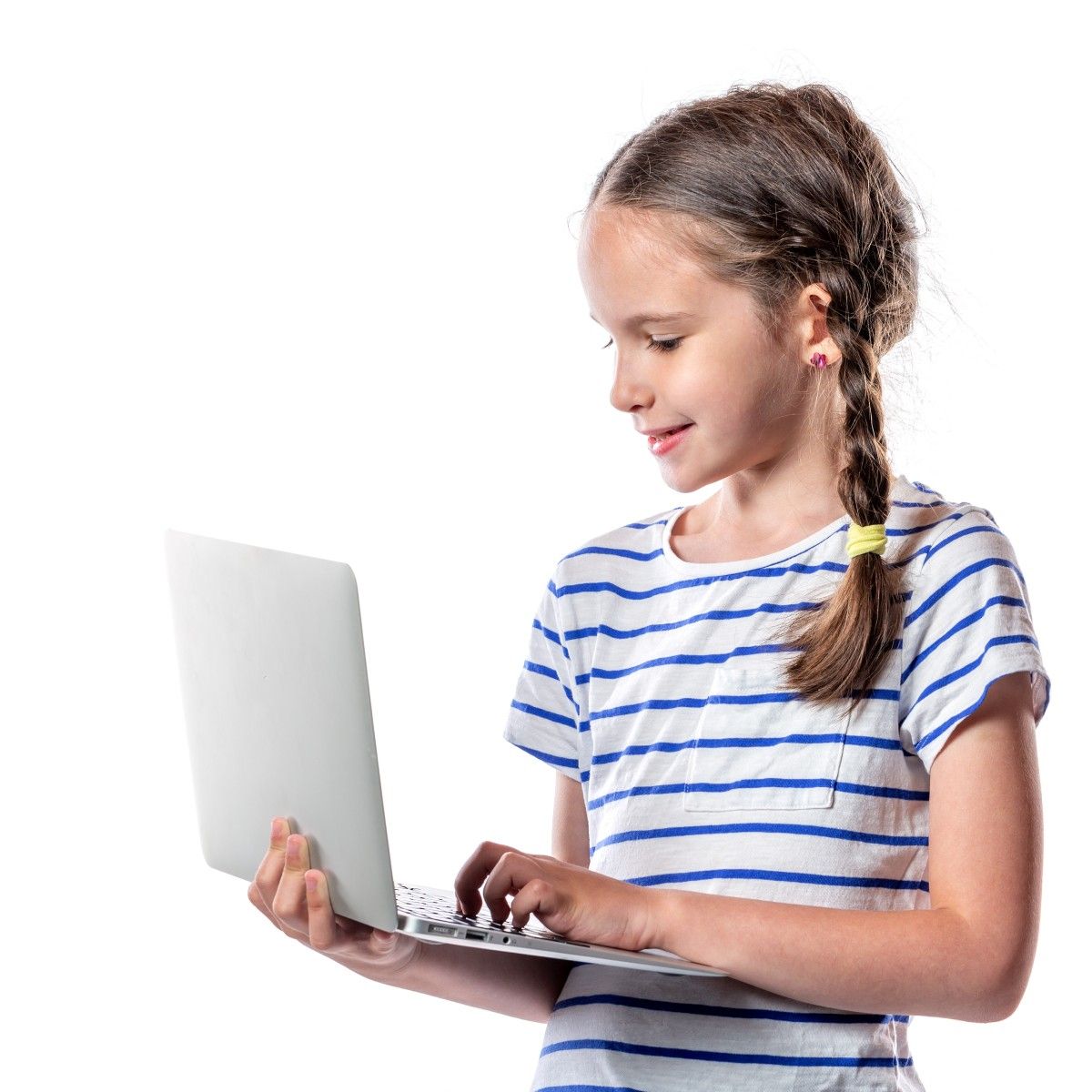 A young, blonde-haired girl stands holding a silver laptop to represent young children using the internet and social media