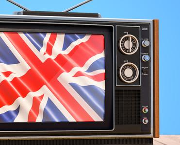 An old TV set displays the British flag on the screen to represent watching BBC iPlayer with Surfshark VPN.