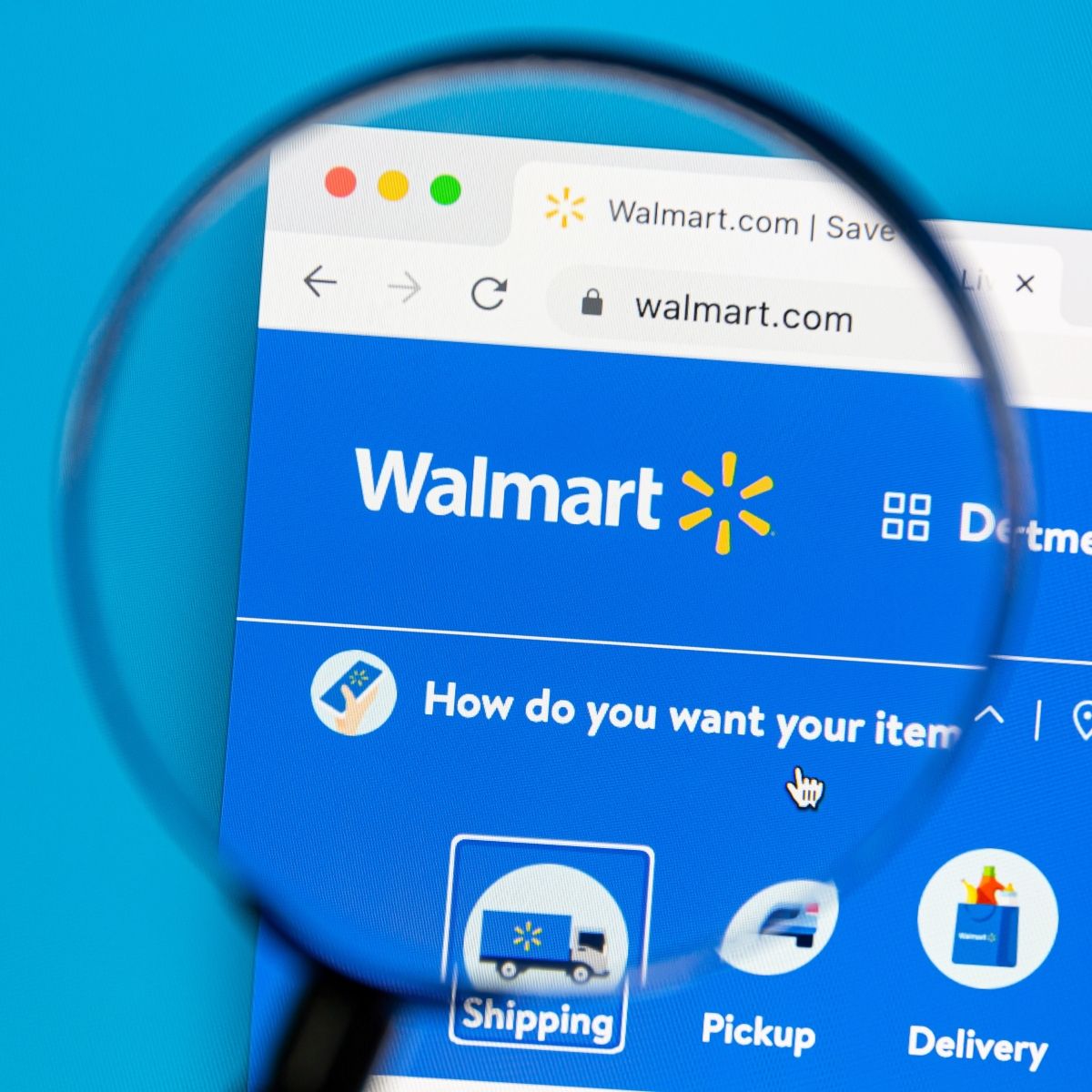 Home page Walmart website with magnifying glass zooming on logo