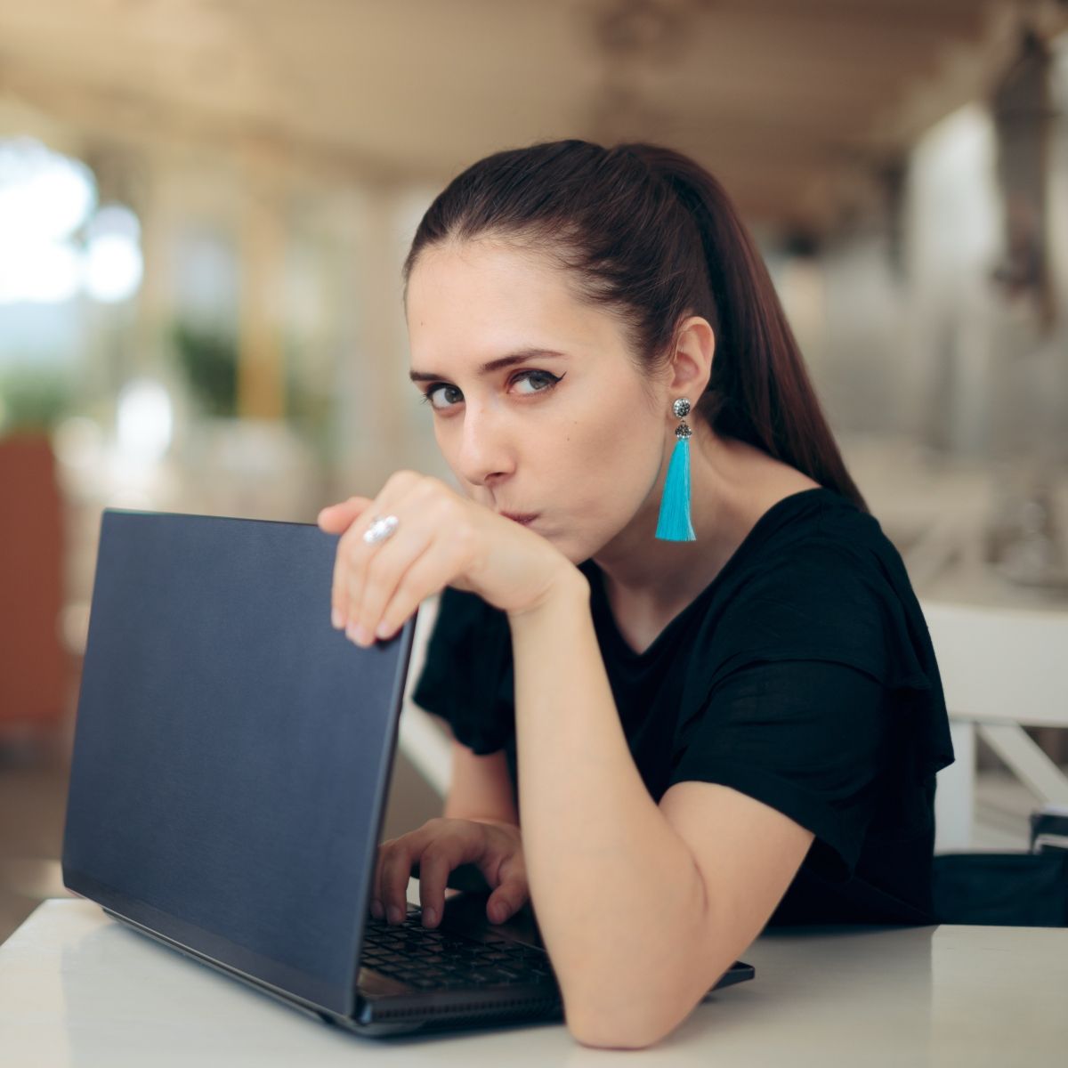 woman hiding her laptop screen