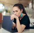 woman hiding her laptop screen