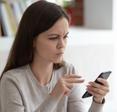 Woman looking upset at phone