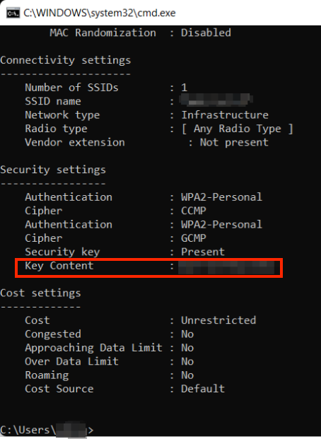 A screenshot showing the Windows Command Prompt window with Key Content and the user's blurred out Wi-Fi password highlighted in red