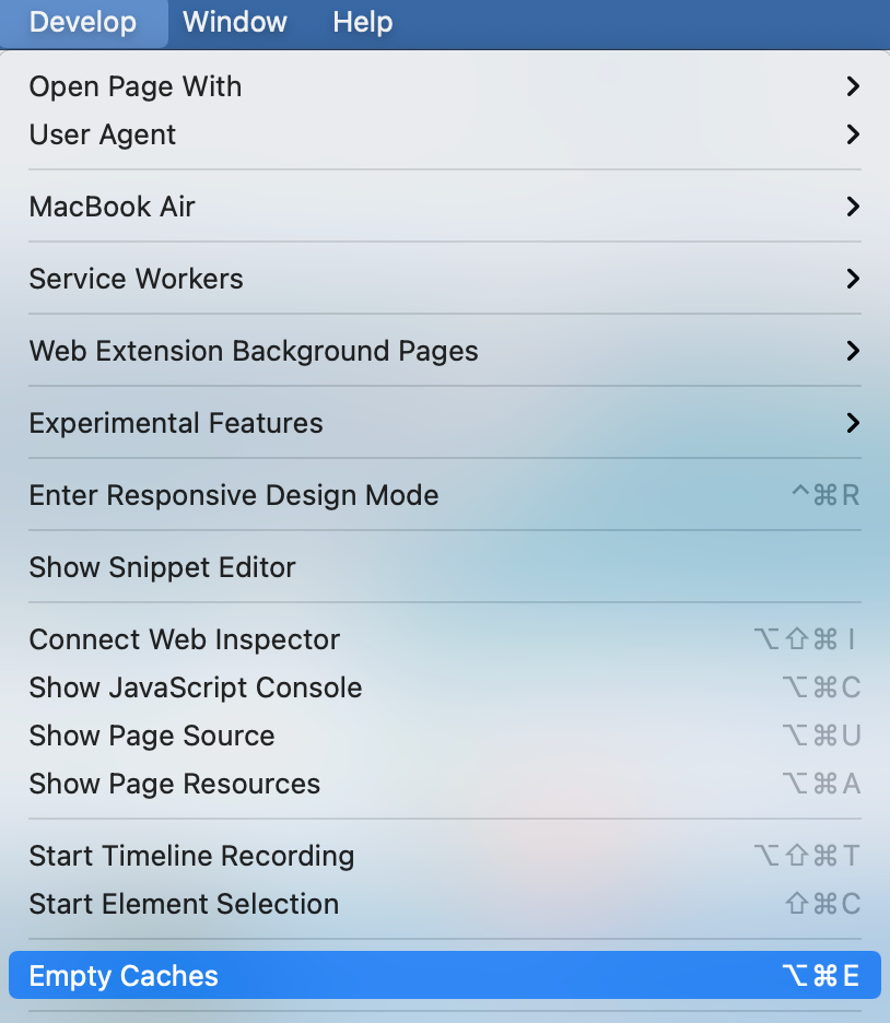 A screenshot of the Apple Safari web browser's Develop menu and the Empty Caches option highlighted