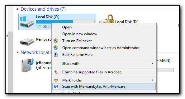 A screenshot showing the C: drive on a computer and the option to Scan with Malwarebytes Anti-Malware software selected